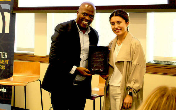 photo of Luvuyo Rani and Maria Rodriguez Contreras as she receives the Outstanding Social Entrepreneur of the Year Award